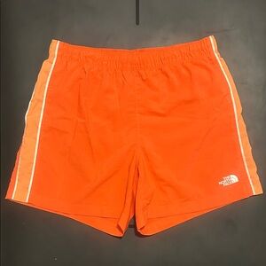 The North Face Vibrant Orange Shorts with White Stripes